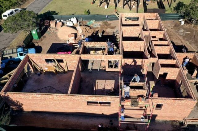 The brickwork now up to roof height, with the lintels in place the roof can commence